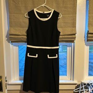 Black dress with white details.